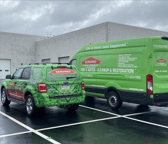 SERVPRO vehicles in a commercial parking lot