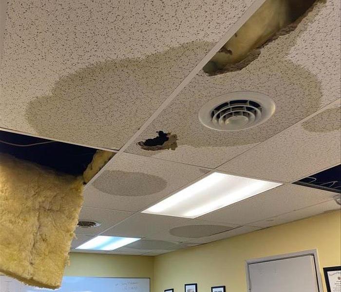 Wet ceiling tiles and insulation from a pipe bursting